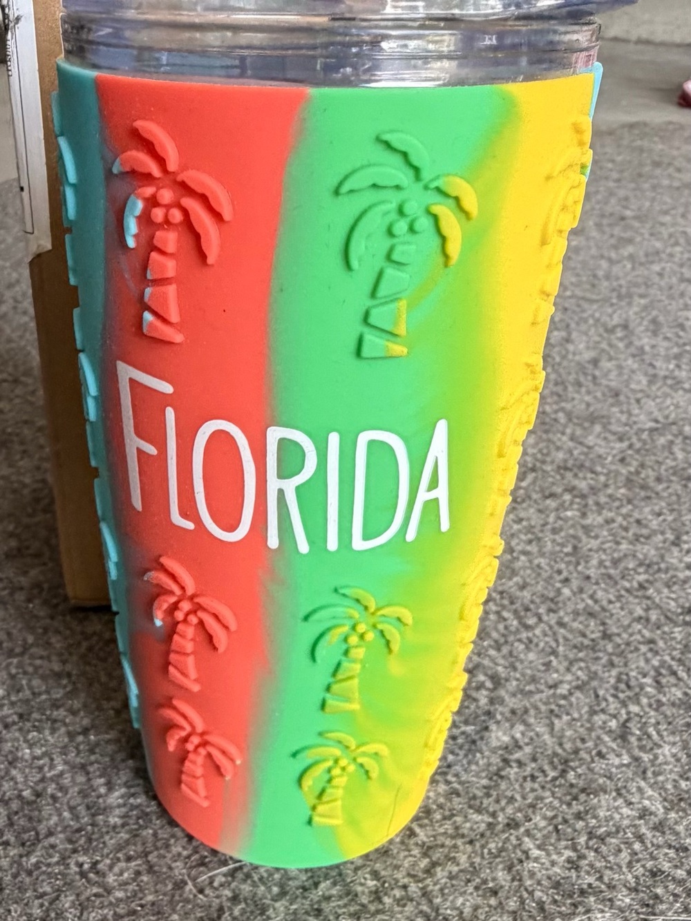 The tumbler evokes a classic Florida beach vacation with bright tropical colors